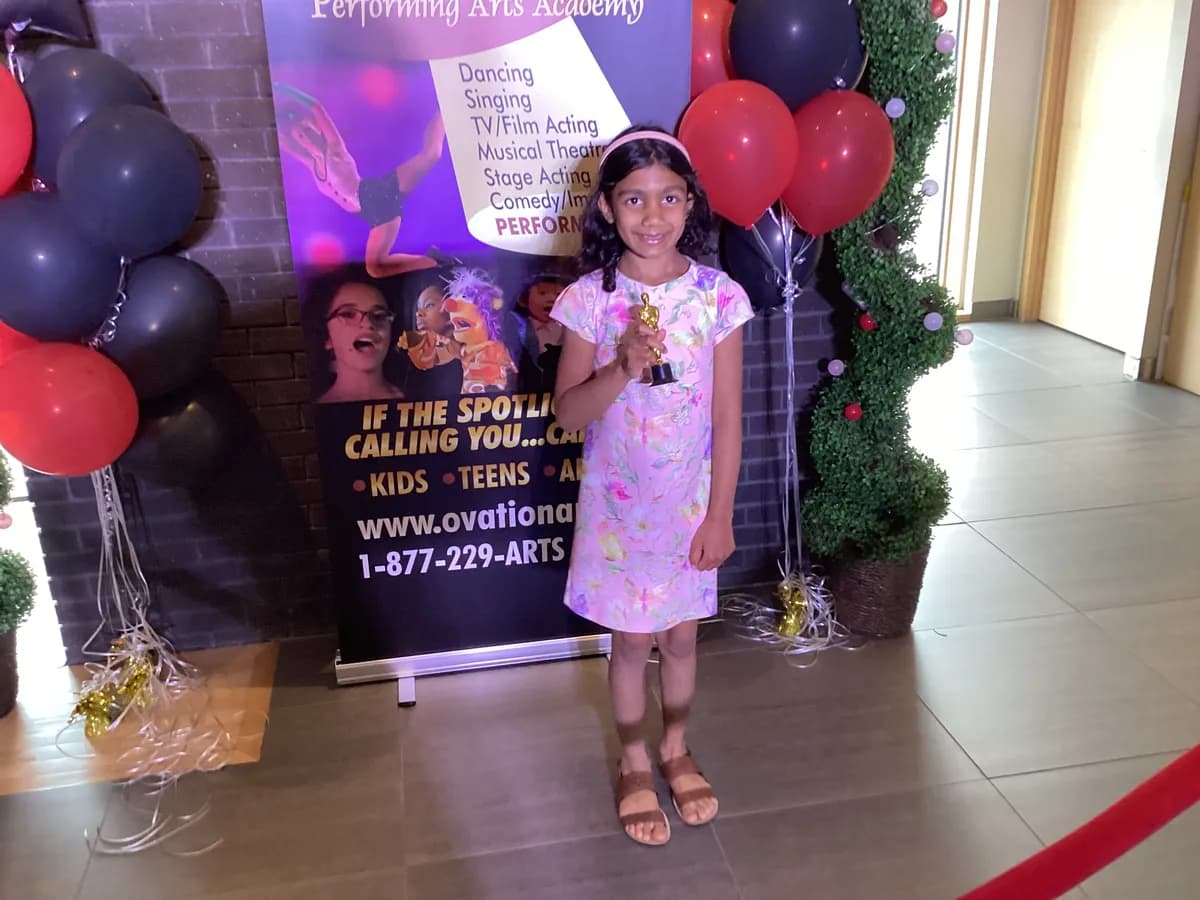OVATION! young screen acting student holding awards at the That's A Wrap Film Fest in Richmond Hill