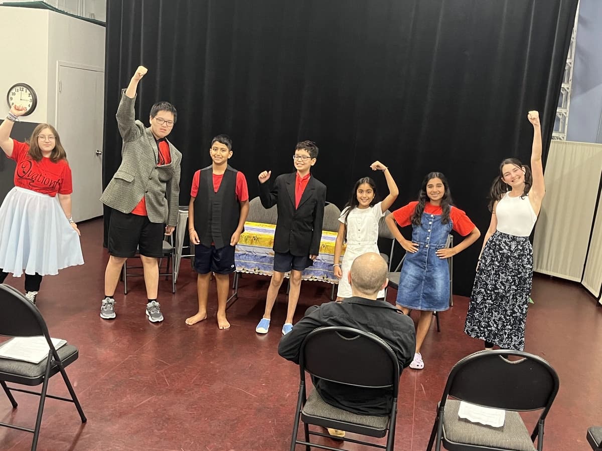 OVATION! comedy camp students posing with fists raised at the Richmond Hill summer programme