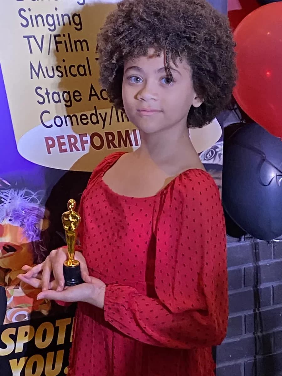 OVATION! student holding her gold award at the That's A Wrap Film Fest in Richmond Hill