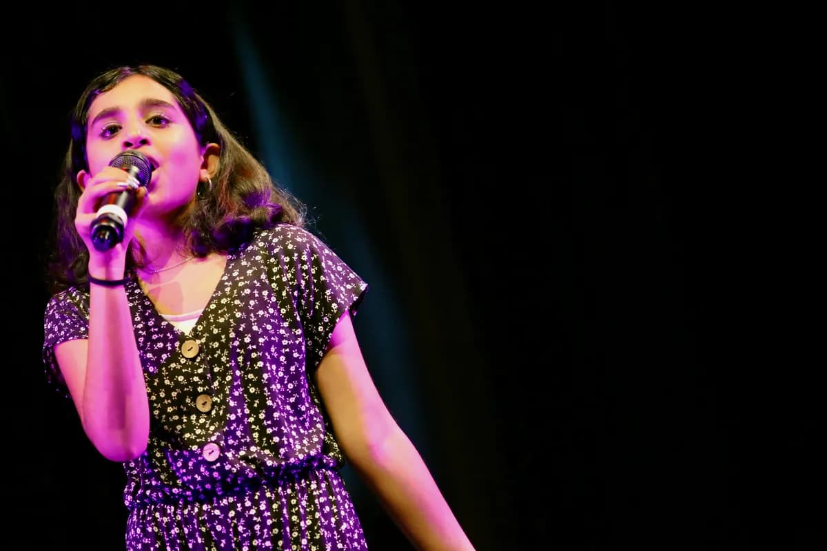 OVATION! student learning to sing with a microphone in Richmond Hill