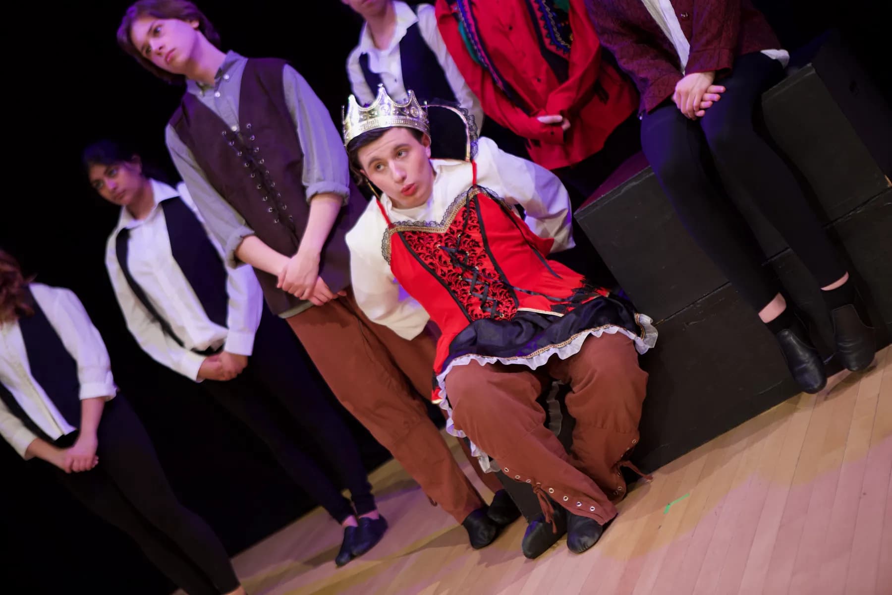 OVATION! student in a royal costume with the cast behind during the Musical Theatre Production in Richmond Hill