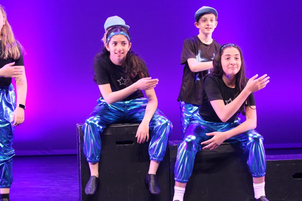 OVATION! students in metallic blue costumes performing during Get STAGEstruck! in Richmond Hill