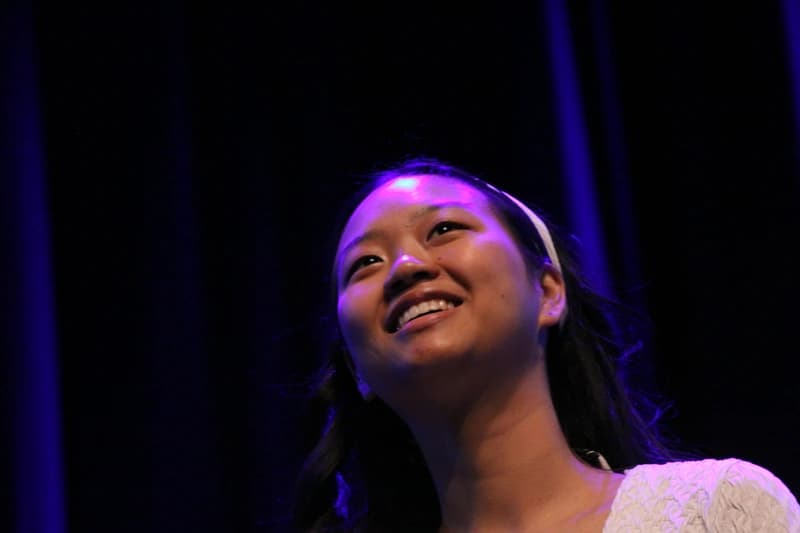 OVATION! senior acting student smiling on stage during the Senior Acting Production in Richmond Hill