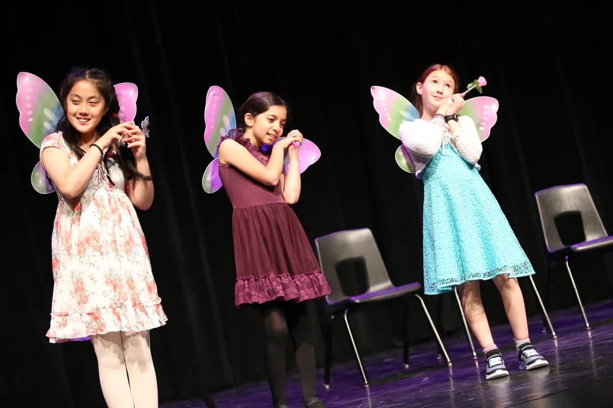 Students in butterfly wings performing in a Richmond Hill stage acting class at OVATION!