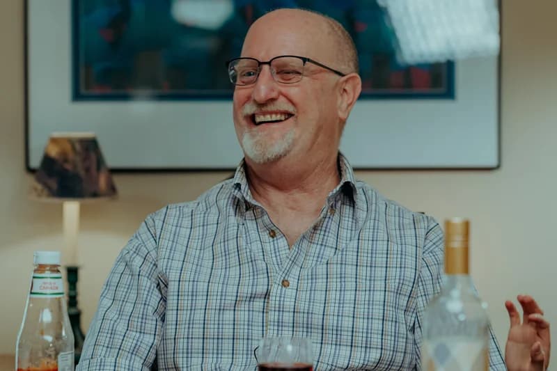 OVATION! adult acting student laughing during a dinner-scene film shoot