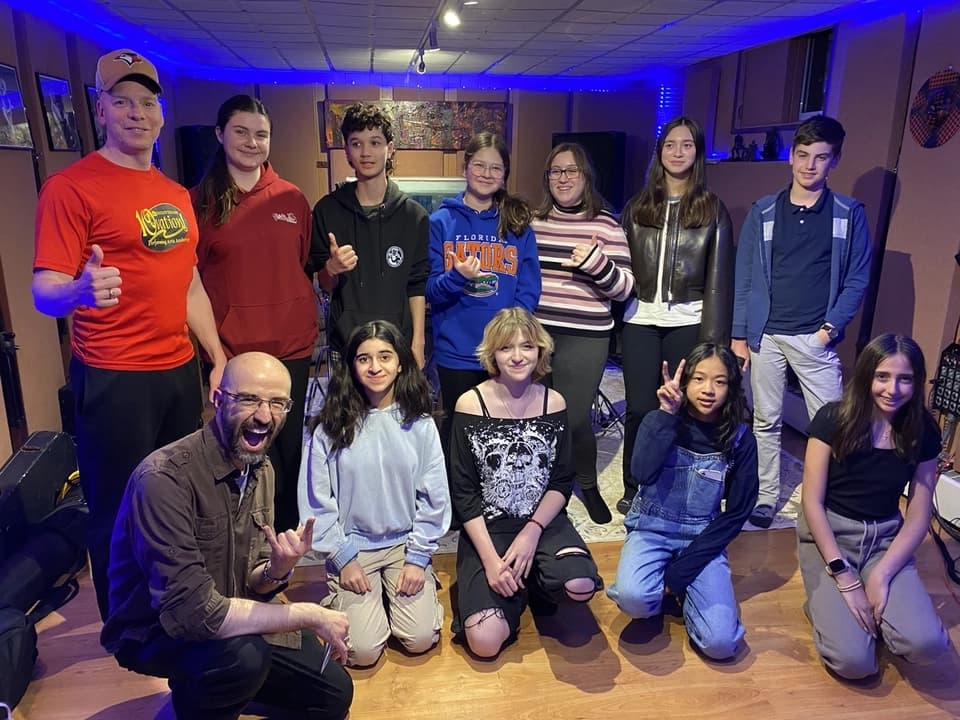 OVATION! adults and teens summer camp group gathered in the blue-lit Richmond Hill studio