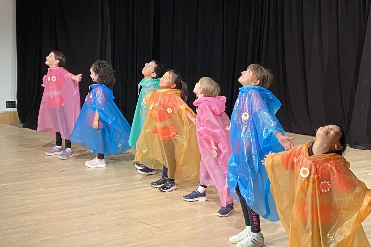 OVATION! Primary students in colourful capes performing at Get STAGEstruck! Primary in Richmond Hill