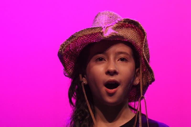 OVATION! musical theatre camp performer singing in costume under pink stage lights in Richmond Hill
