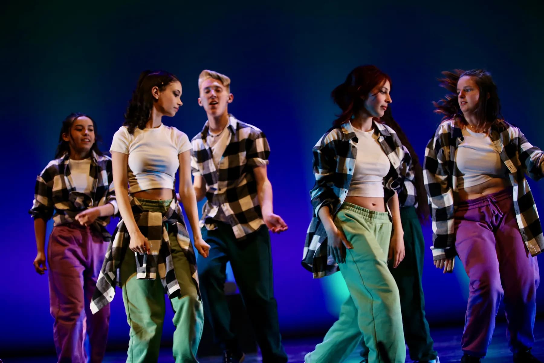 OVATION! musical theatre dance students in plaid shirts performing under blue light in Richmond Hill