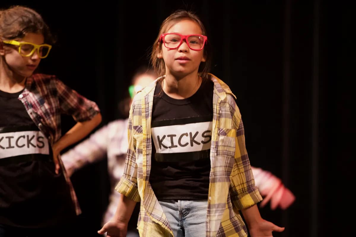 Students performing in a Richmond Hill comedy class showcase at OVATION!