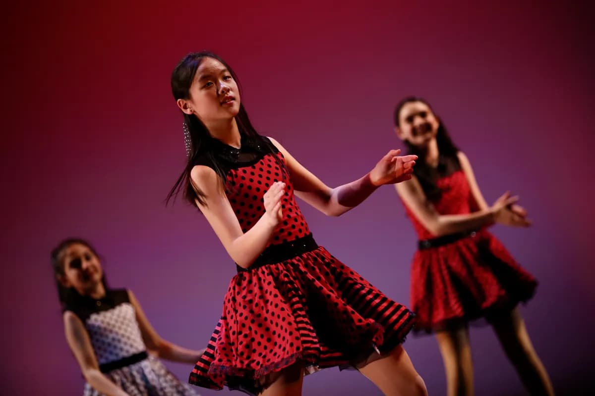 OVATION! tap dancers in red and black polka-dot dresses performing at a Richmond Hill showcase