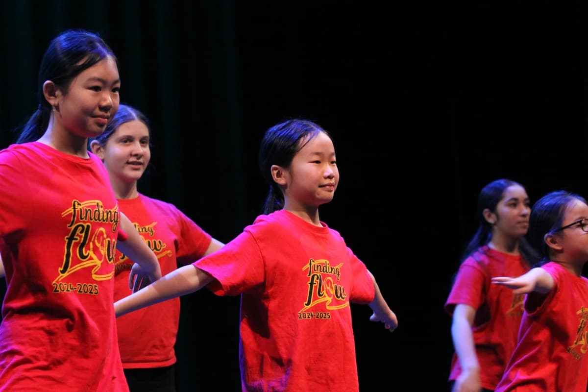 OVATION! students in show t-shirts performing during the Winter Showcase in Richmond Hill