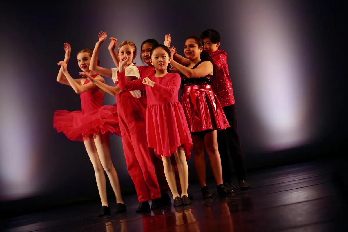 Students performing in a jazz dance class