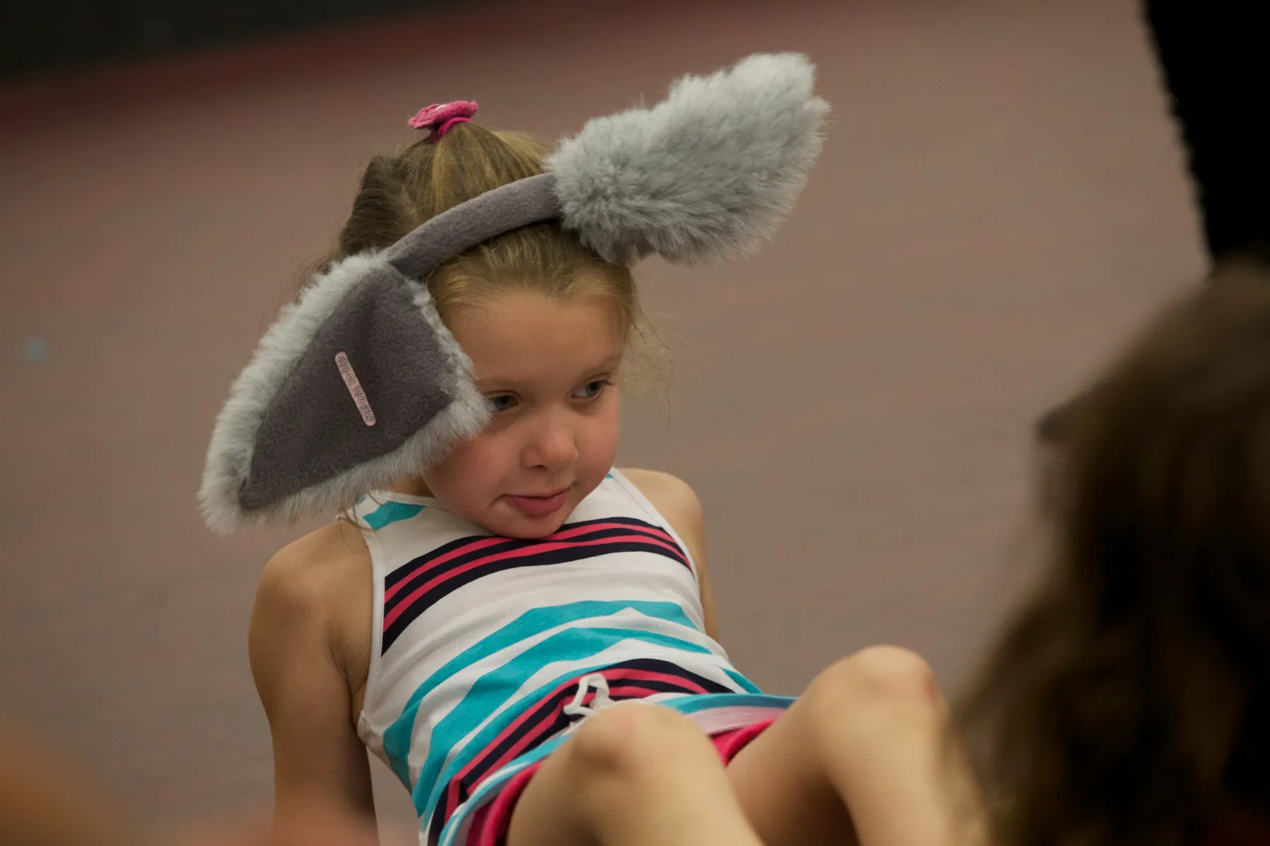 Kid in a musical theatre summer camp with bunny ears on