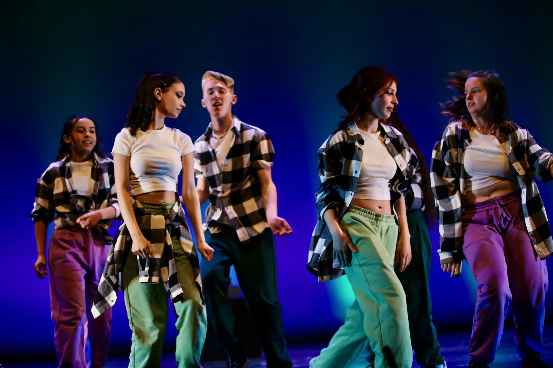 Dancers practing musical theatre dance skills