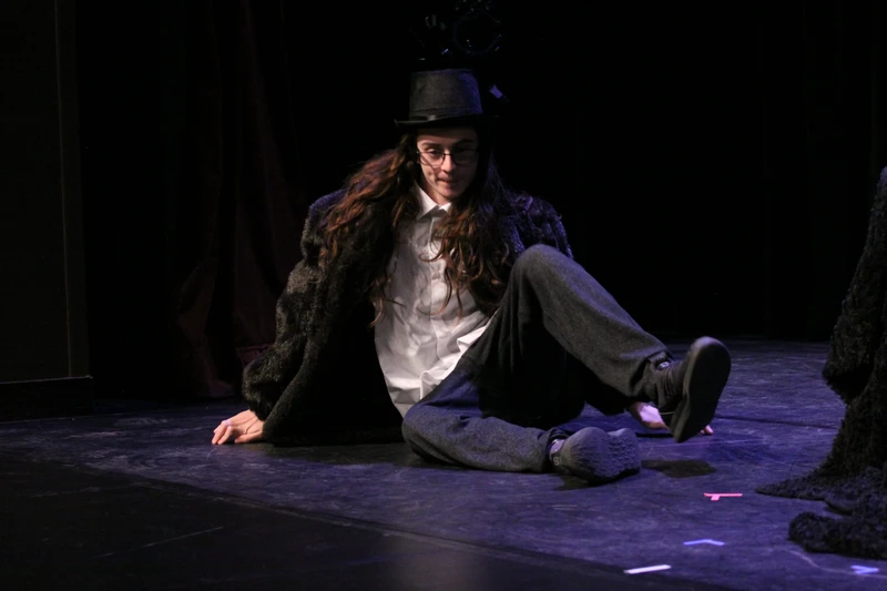 Student performing in costume for a comedy class