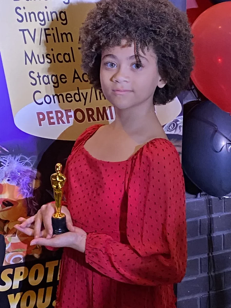 Ovation That's A Wrap Film Fest Student Holding Awards